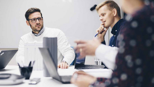 Group of employees at Micropower in a meeting with BRIX